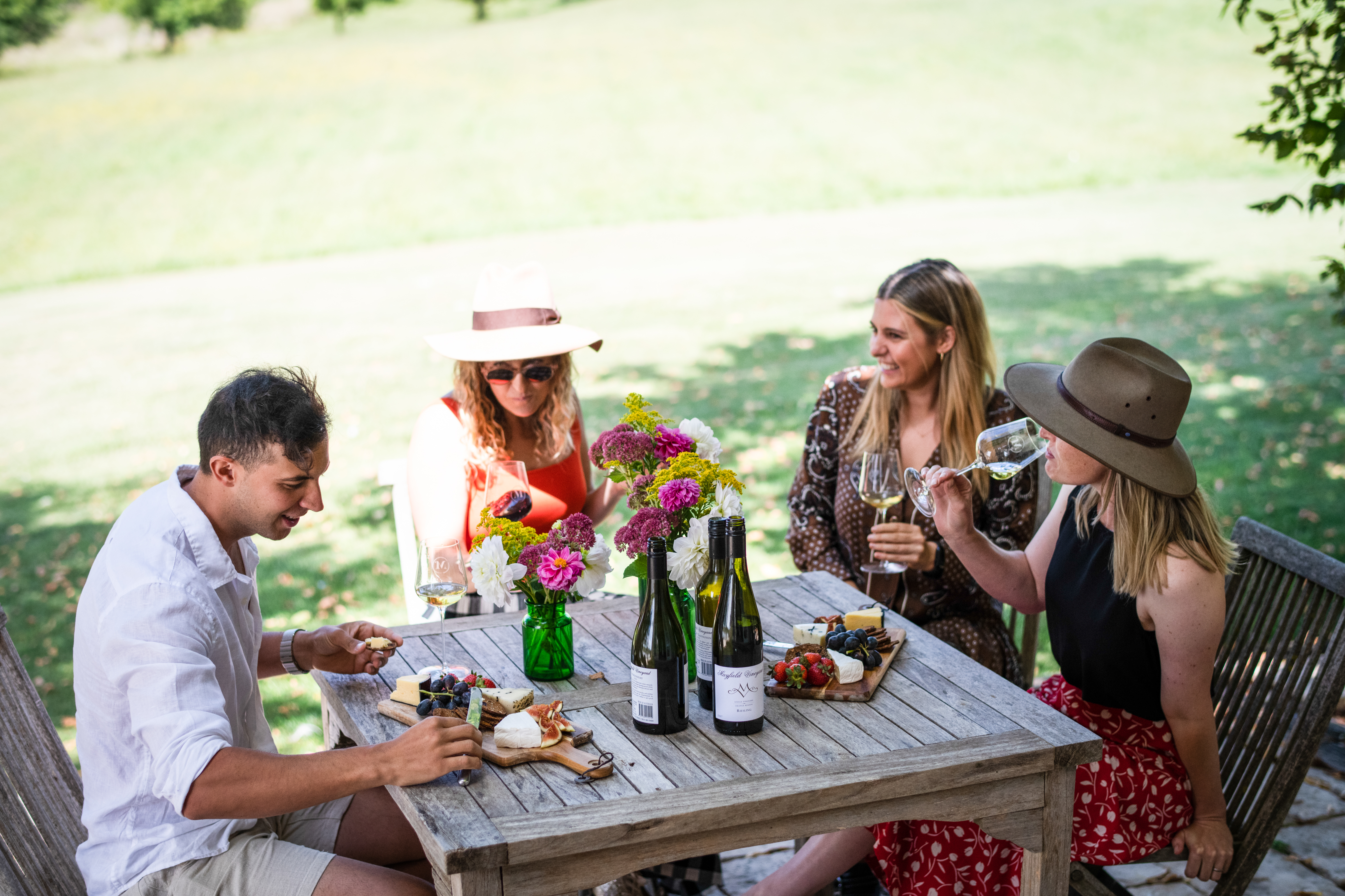 People drinking wine at Mayfield cellar door